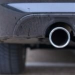 Low angle view of an exhaust pipe on a car.