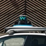 top of Waymo car, showing equipment on roof