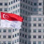The Singapore flag on top of the parliament building ahead of incoming Prime Minister Lawrence Wong's swearing-in ceremony in Singapore, on Wednesday, May 15, 2024. Wong, Singapore's fourth prime minister since independence, will have to tackle rising cost-of-living concerns, balance US-China tensions and plan for an election after succeeding Lee Hsien Loong. Photographer: Nicky Loh/Bloomberg via Getty Images