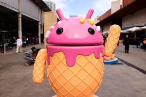 The Google Android logo and mascot, known as Bugdroid by the community, is being displayed as a statue resembling a strawberry ice-cream cone on Android Avenue at the Mobile World Congress 2024 in Barcelona, Spain, on March 25, 2024.