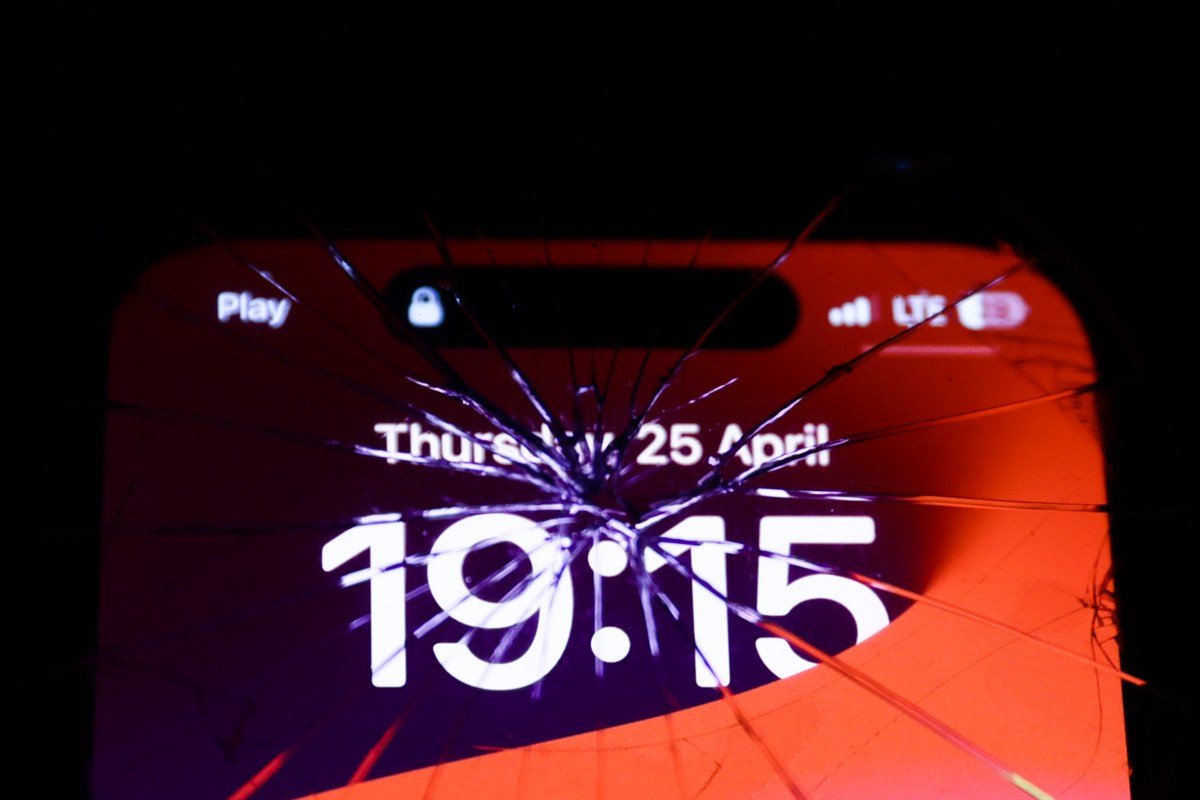 iPhone screen is seen through the broken glass in this illustration photo taken in Krakow, Poland on April 25, 2024.