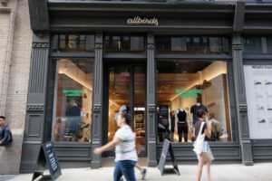 NEW YORK, NEW YORK - AUGUST 31: People walk past an Allbirds store, a maker of sustainable shoes, in lower Manhattan on August 31, 2021 in New York City. The shoe company has announced that it is preparing an initial public offering (IPO). The company has lost money and expects it will continue to be unprofitable for the foreseeable future. (Photo by Spencer Platt/Getty Images)