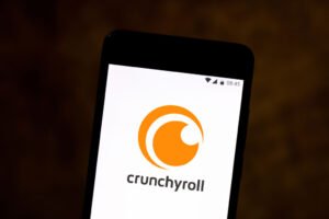 In this photo illustration a Crunchyroll logo seen displayed