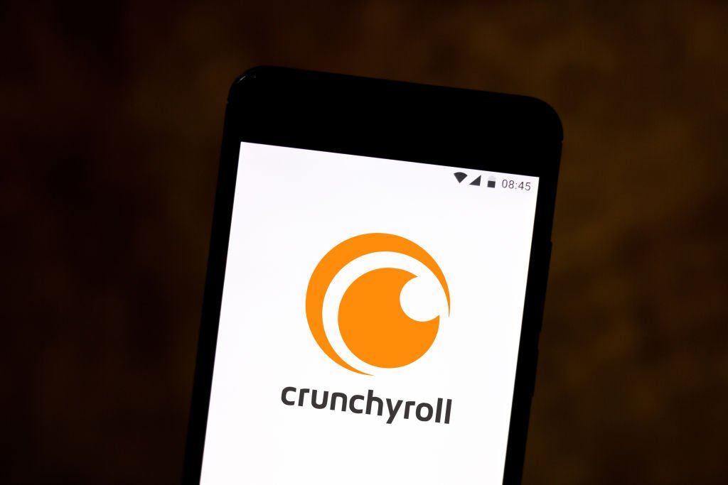 In this photo illustration a Crunchyroll logo seen displayed