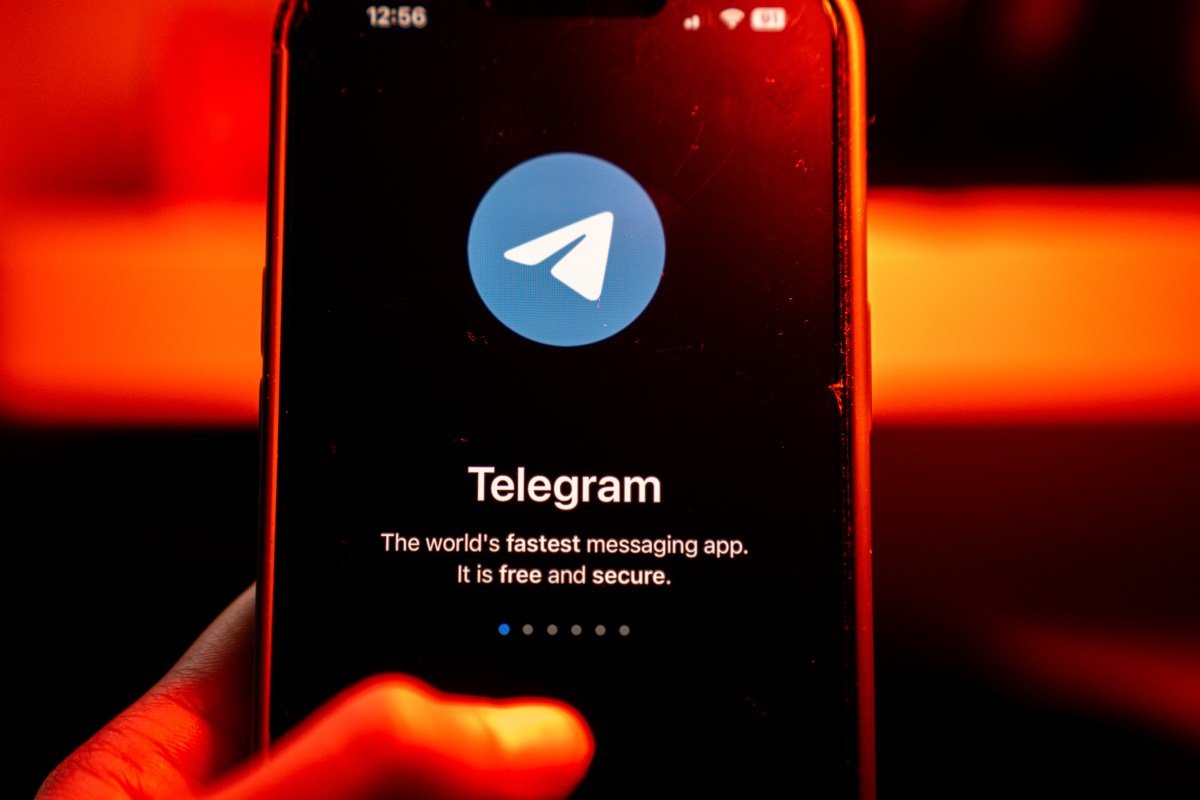 The logo for Telegram chat messenger application arranged on a smartphone.