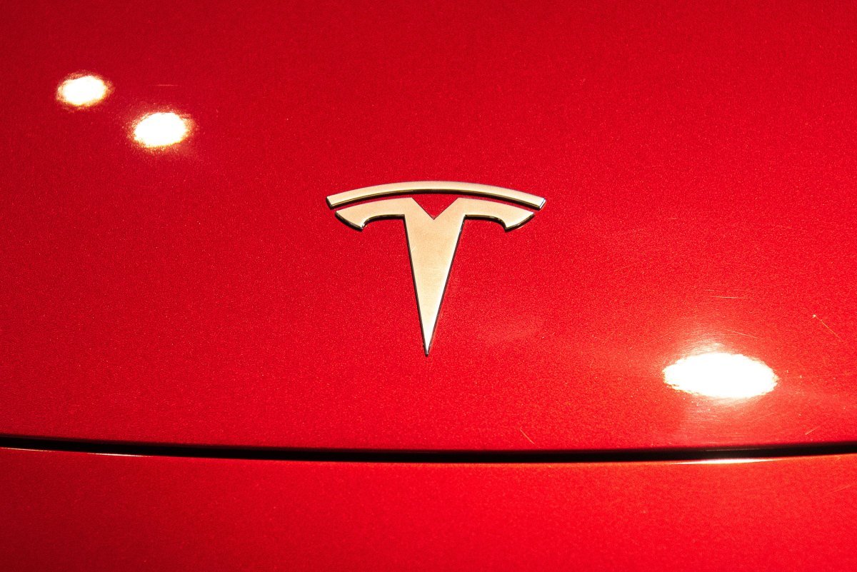 A Tesla logo seen on a Tesla Model 3 car.