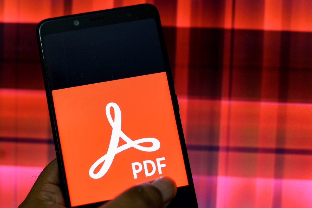 In this Photo illustration an Adobe PDF logo seen displayed on a Smartphone.