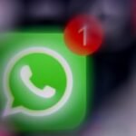 This illustration photograph taken on December 1, 2025, shows the logo of US instant messaging software Whatsapp displayed on a smartphone's screen.