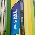 A banner flag with the ASML logo outside the Brainport Industries Campus, which houses the ASML Academy, in Eindhoven, Netherlands.