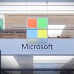 A Microsoft store entrance with the company's logo on top in midtown Manhattan