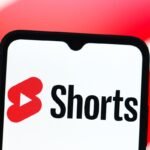 In this photo illustration, the YouTube Shorts logo is seen displayed on a smartphone screen.