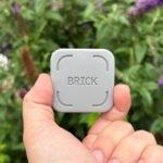a Brick held between thumb and forefinger