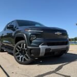 A Silverado EV stands with its front wheels turned.