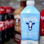 Fairlife ultra-filtered fat free, whole, and chocolate milk and Coca-Cola bottles arranged in Germantown, New York, US, on Tuesday, Dec. 3, 2024. Fairlife, which uses a specialized filtering process to boost protein and cut sugar and lactose in its milk products, helped spark the modern protein craze that's unfolded alongside the rise of Ozempic and other GLP-1 drugs. Photographer: Gabby Jones/Bloomberg via Getty Images