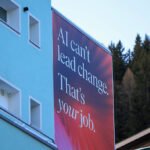 A slogan reading "AI Can't Lead Change. That's Your Job" on a pavilion ahead of the World Economic Forum(WEF) annual meeting in Davos, Switzerland, on Sunday, Jan 18, 2026.