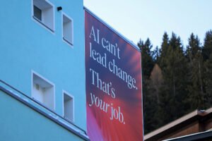 A slogan reading "AI Can't Lead Change. That's Your Job" on a pavilion ahead of the World Economic Forum(WEF) annual meeting in Davos, Switzerland, on Sunday, Jan 18, 2026.